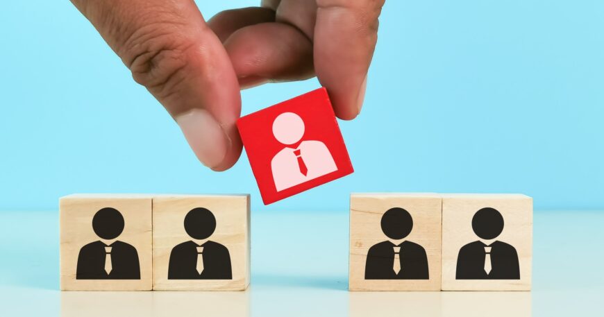 choosing good employee leader. Man choose and take wooden cube.