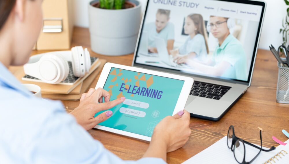 Young woman using digital tablet to sign in online educational site