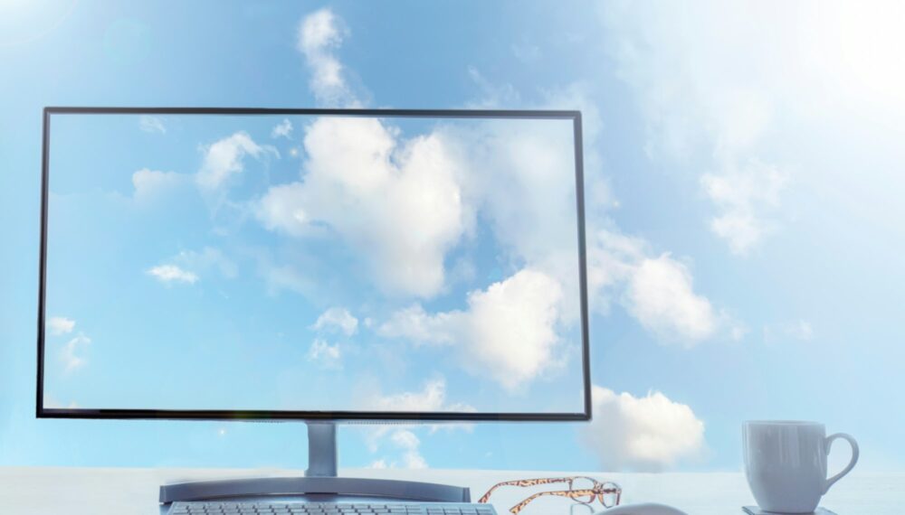 Office in the sky, cloud computing concept. Desktop with keyboard, mouse and coffee. Office in the sky, cloud computing concept. Desktop with keyboard, mouse and coffee.