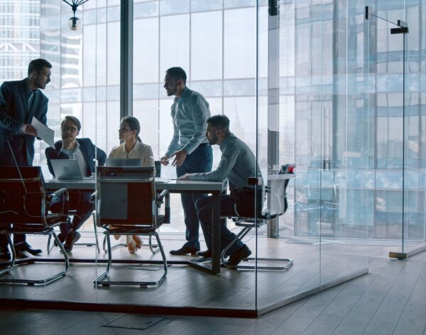 Corporate leader handing out statistics of the company's financial development strategy Corporate leader handing out statistics of the company's financial development strategy