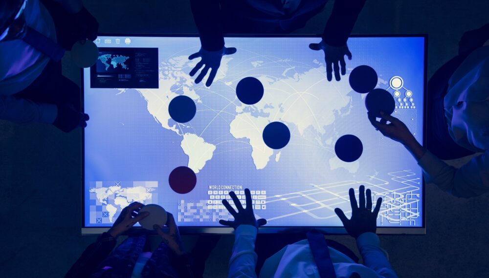 People in a world connection technology meeting People in a world connection technology meeting