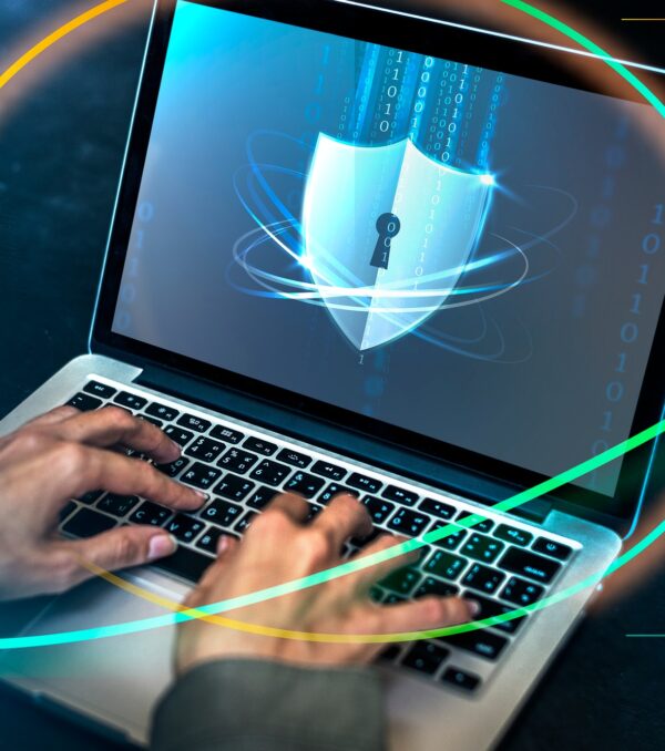 Hacker cracking the security code on a laptop