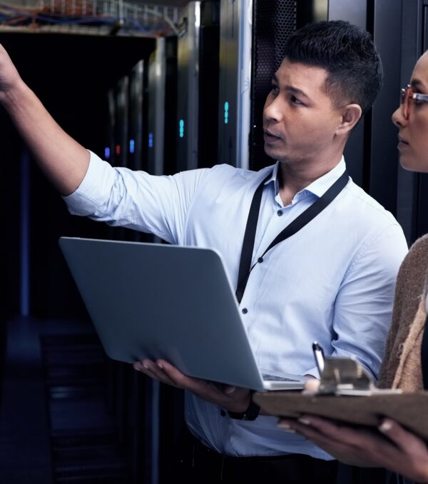 Its not safe until IT support says so. Shot of two technicians working together in a server room. Its not safe until IT support says so. Shot of two technicians working together in a server room.